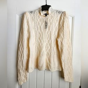 Beautiful ivory color sweater in size medium.